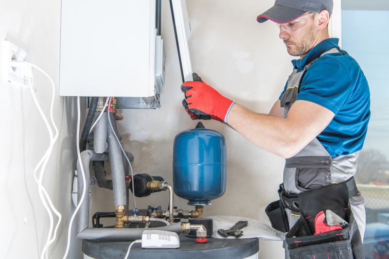 Technician Inspecting Water Heater